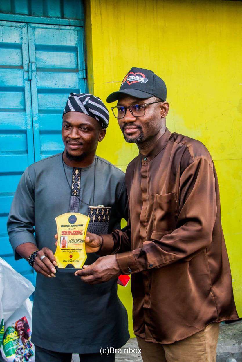 Dr. Samsondeen with a community chief in traditional dress