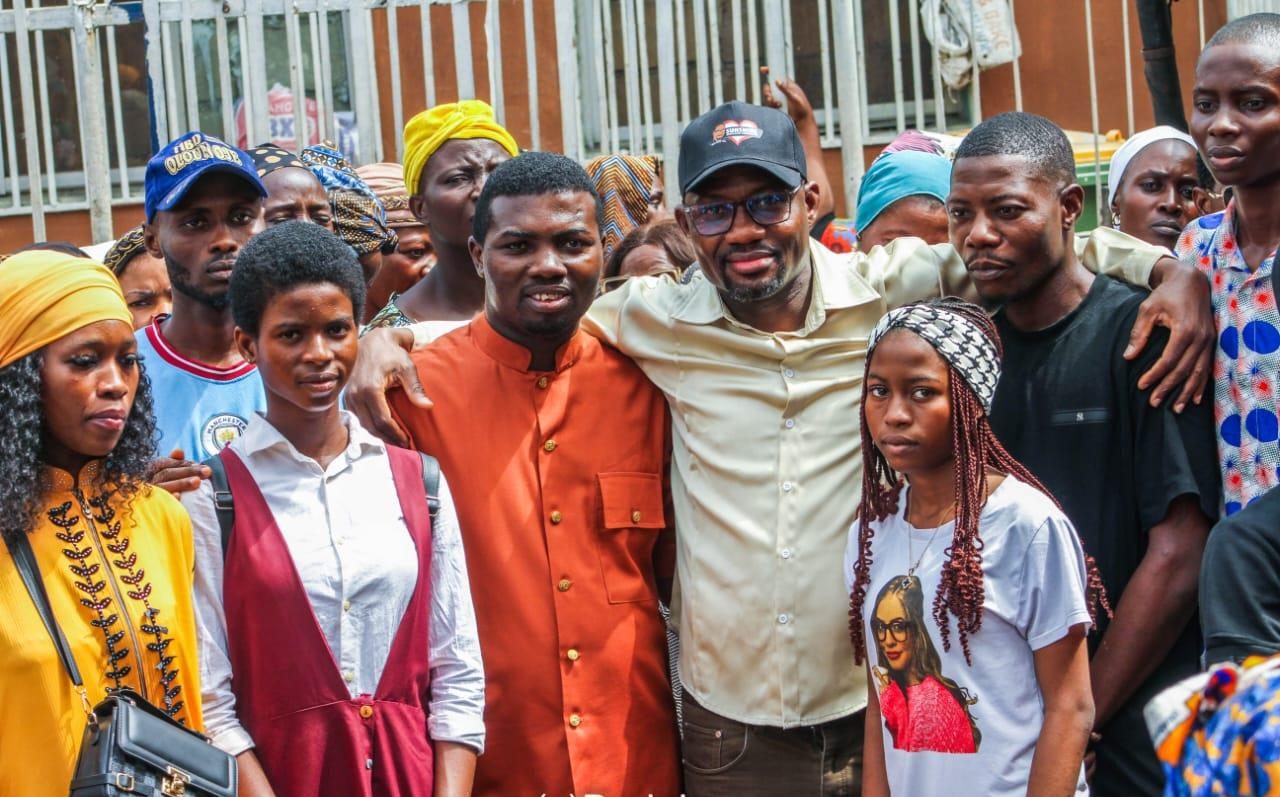 Founder with beneficiaries and volunteers